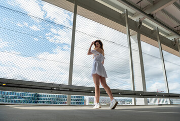 Naklejka premium Beautiful woman spending time in the urban district of Stuttgart city