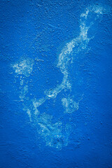 Textured blue Background with white abstract design on grunge concrete wall. Abstract paint pattern