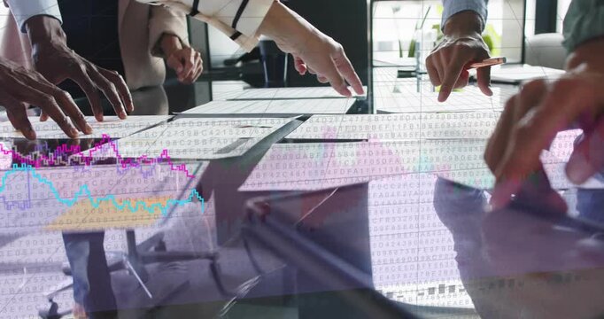 Business team pointing at charts on glass table, tablet tapping initiating overlays showing trends