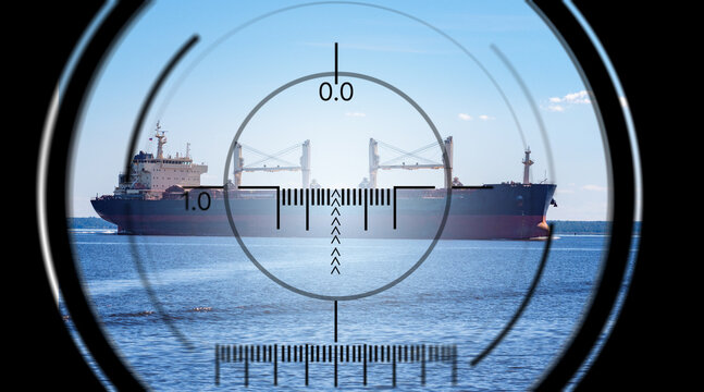 Naval surveillance, cargo ship observed in military scope sight on open water, maritime security monitoring, defense targeting operation and strategic sea transport control.