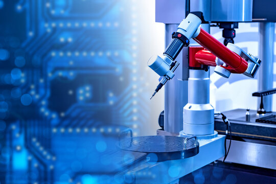 Industrial automation engineering, robotic machining. Precision robotic arm operates on manufacturing workstation with microelectronics background, enabling automated production and quality control.