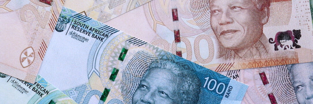 South African rand paper banknotes pile on table. South Africa ZAR currency money bills in big amount. Concept of economics, taxation and banking in South Africa
