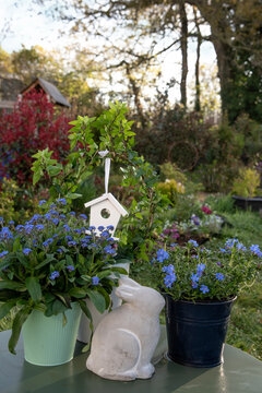 Easter decor with spring flowers easter bunny in a garden