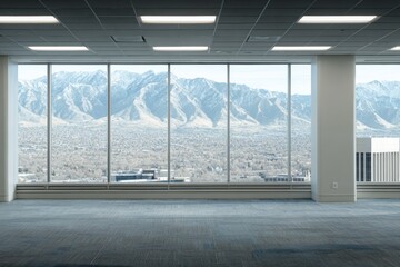 Obraz premium Modern Office Space with Expansive Windows and Mountain View: A Bright, Empty Interior