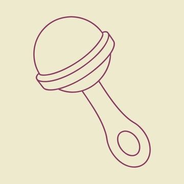 Maroon baby rattle on beige background