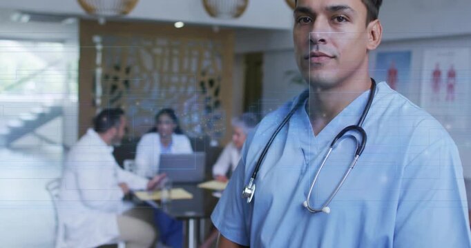 Camera zooming in as doctor in scrubs with stethoscope turning to camera, smiling, leading meeting