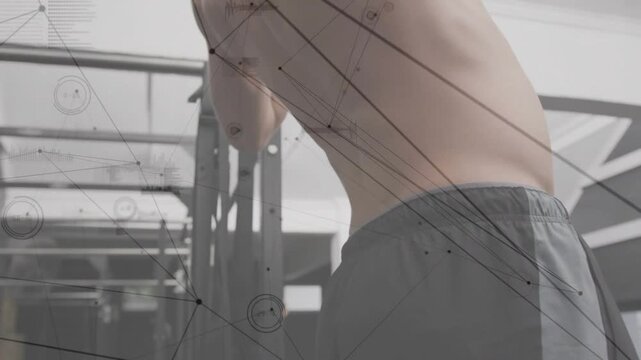 Vertical video: Shirtless man gripping pull-up bar initiating pull for fitness, HUD tracking muscle