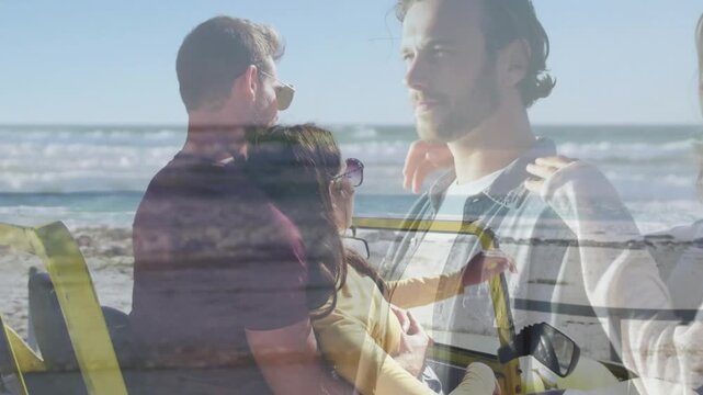 Two couples sitting in yellow vehicle on beach, crossfading overlay revealing travel outing