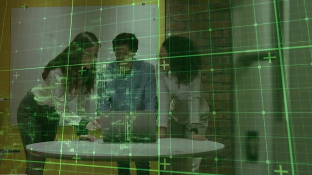 Three colleagues leaning over laptop, left tapping keys, activating green HUD, solving tech issue