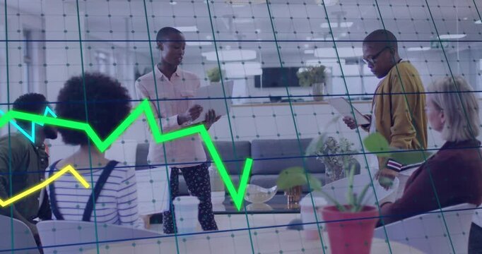 Host tapping tablet speaking in business meeting line charts sweeping grid over team showing sales