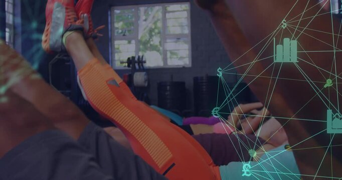 Participants performing V-up reps on cue to tone core in gym, network overlay on right