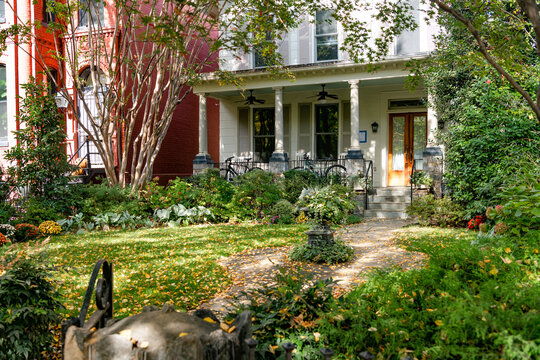 Historic rowhouse architecture with bay windows and autumn foliage Washington DC neighborhood USA