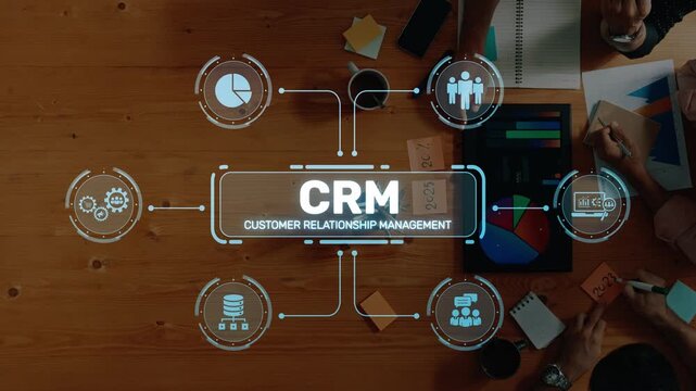 Explore the concept of customer relationship management (CRM) through visual elements including charts and collaboration tools on a stylish wooden desk, emphasizing teamwork and strategy. Raster