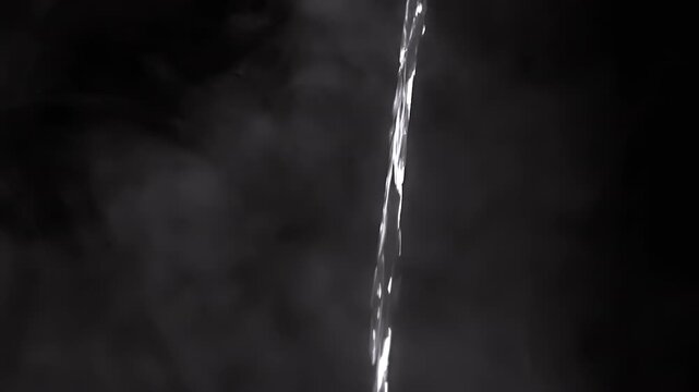 A breathtaking visual of water streaming intricately with hot swirling smoke, creating a truly captivating atmosphere