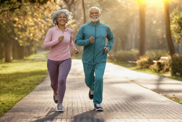 Fototapeta premium Active Senior Couple Jogging in Sunny Park