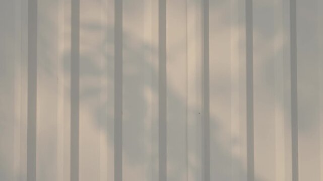 Minimal shadow pattern on metal surface, clean abstract background