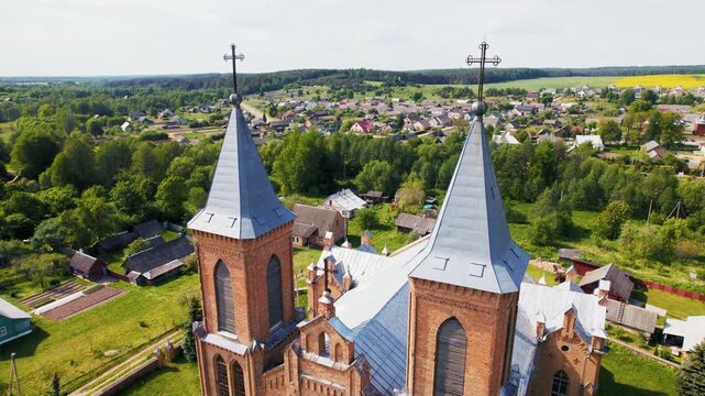 Aerial view flying over a gothic catholic church building