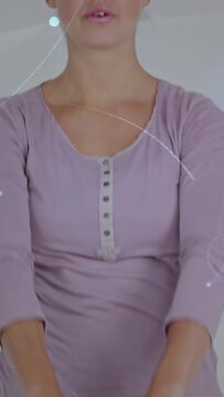 Vertical video: Woman gripping 4kg kettlebell starting front fitness lifts light flares accent form