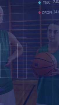 Vertical video: Sports players waiting holding ball eyeing coach presenting charts scrolling