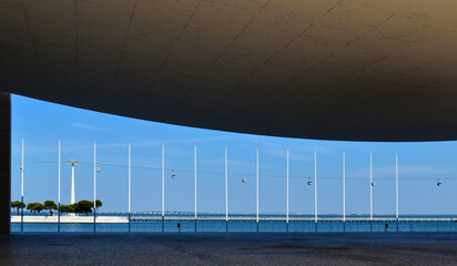 Portuguese National Pavilion in Lisbon, modern architecture framing a scenic view of a cable car over the water © Klara Bakalarova
