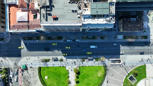 Aerial drone top down cinematic video of Athens centre dense urban landmark buildings near area of Syntagma square and Athens neoclassic trilogy in Panepistimiou street, Attica, Greece