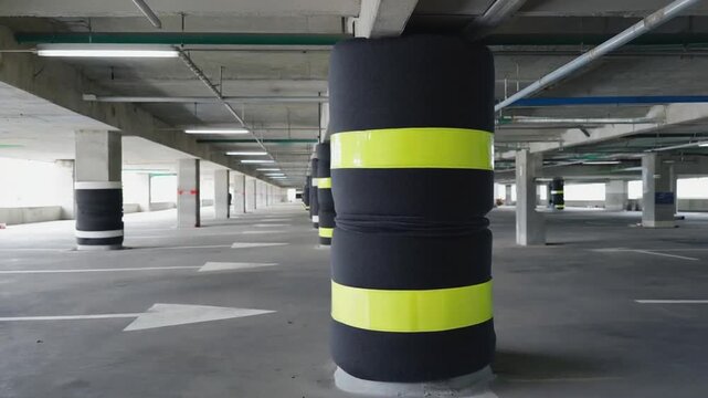 Padded protection on columns in a parking lot.