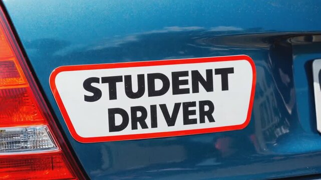 Student driver sticker on a car.