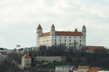 Fototapeta premium Historical Bratislava Castle with crown tower and white stone walls, Slovakia 