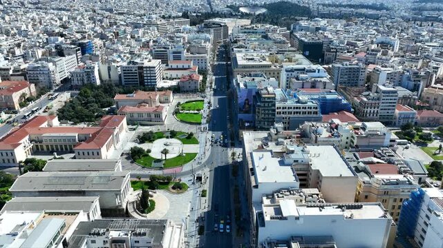 Aerial drone cinematic video of the Neoclassical Trilogy buildings , the National Library, the old University of and the Academy of Athens on Panepistimiou str., Athens historic centre, Attica, Greece