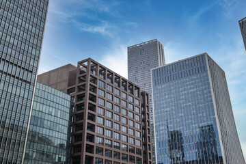 Obraz premium Urban cityscape featuring glass corporate skyscrapers and business towers
