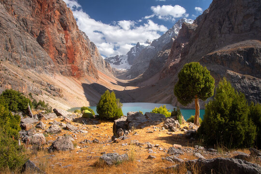 Amazing Summer Landscape of Wild Mountains and Blue Lake with Rocks and Trees