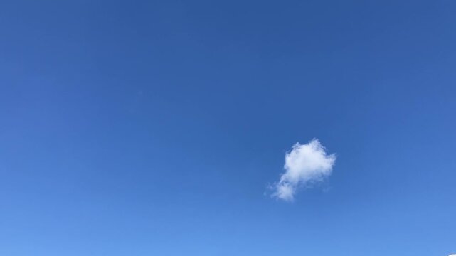 Solitary Cloud in Azure Sky