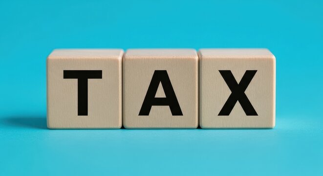 Tax concept represented by wooden blocks on a blue background