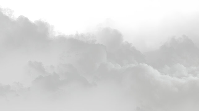 Thin white clouds float in a clear sky during daytime creating a soft and light atmosphere