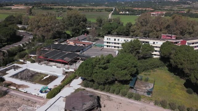 Aerial View of Abandoned Beachfront Hotel on Sandy Coast Near Kalamata