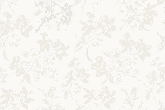 Delicate floral pattern in shades of white and pale gray
