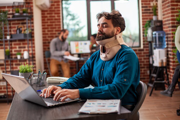 Professional male analyst evaluating research data on a digital device and handling work...