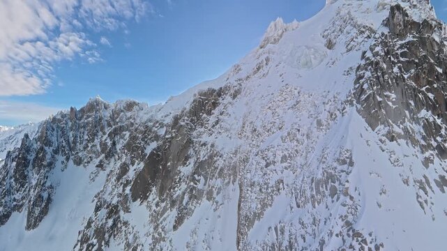 Cable car journey over snowy peaks to Aiguille du Midi Chamonix