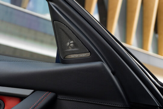 Black BMW M3 harman kardon speaker on door panel, Luxury performance sports sedan interior detail