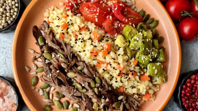 A bowl with beef, porridge, mushrooms, vegetables, sauce, and spices. Beef bowl as a food background for your design