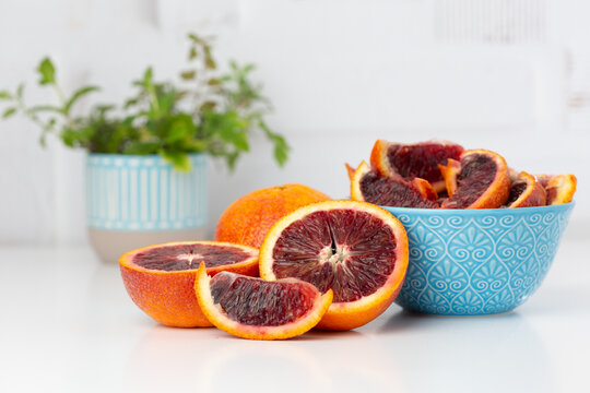 Blood Oranges on a Kitchen Counter, Whole, Halves, and Sliced