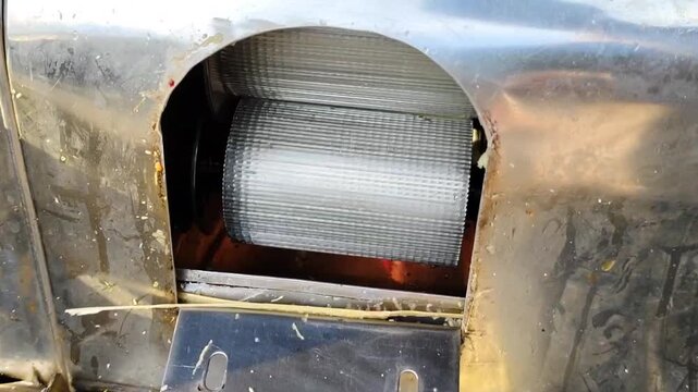 close up of sugarcane juice extraction machine