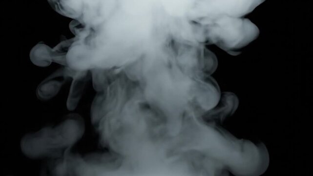 Cinematic atmospheric smoke effect showing a small dense white smoke puff forming at the bottom center of a black background slowly drifting upward with elegant organic motion vapor cloud expanding an