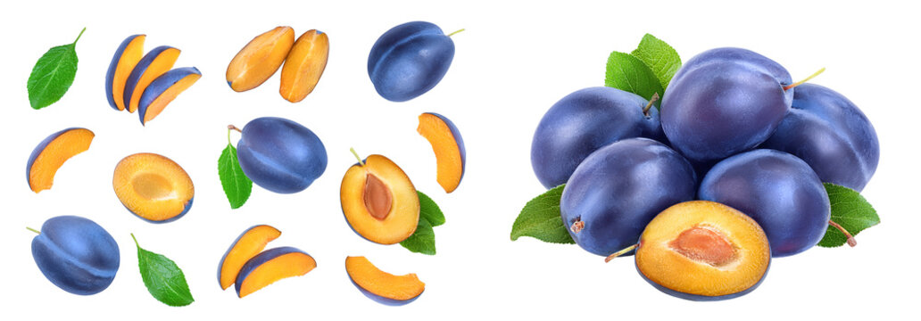 fresh blue plum and half with leaves isolated on white background. Top view. Flat lay