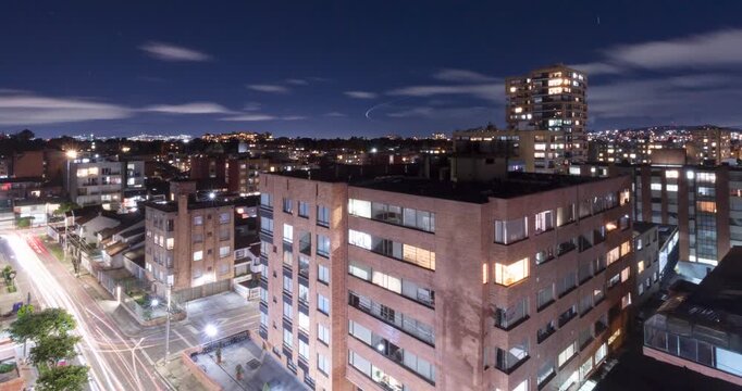 Beautiful zoom out of a bogota colombia night landscape residential neighborhood with clear sky