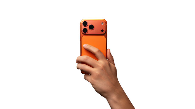 The hand holding a modern orange smartphone with a triple camera, rear view. Isolated on transparent background. Mobile technology and communication concept. PNG File
