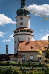 Historic castle tower with green dome in Czech Republic