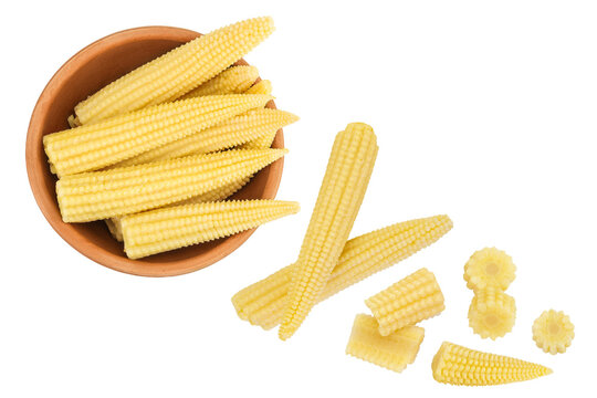 Pickled young baby corn cobs in wooden bowl isolated on white background. Top view. Flat lay
