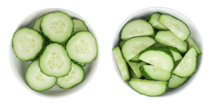 Sliced cucumber in ceramic bowl isolated on white background with full depth of field. Top view. Flat lay.