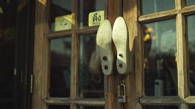 A detailed view of two legs knockers with the pull sticker on the door